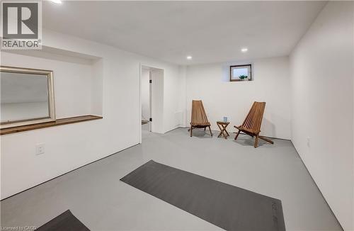 Recessed lighting illuminates the white walls and grey flooring - 59 Allen Street W, Waterloo, ON 