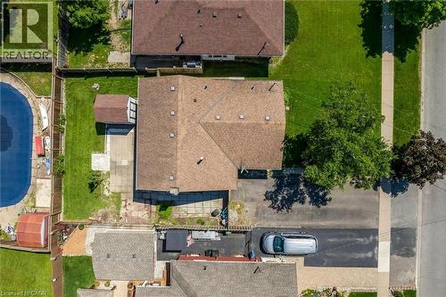 Aerial view showcasing a residential property with a brown shingle roof and multiple skylights - 49 Grove Avenue, St. Catharines, ON 