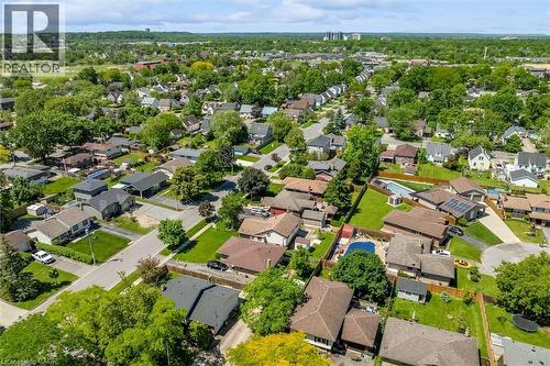 Expansive residential community featuring mature trees, a mix of architectural styles, and private outdoor swimming pools - 49 Grove Avenue, St. Catharines, ON 
