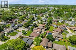 Expansive residential community featuring mature trees, a mix of architectural styles, and private outdoor swimming pools - 