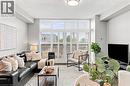 Living space with high ceilings, large windows featuring white plantation shutters, and recessed lighting - 427 Aberdeen Avenue Unit# 105, Hamilton, ON 