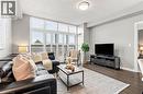 Tall windows with white louvered shutters, dark wood-finish flooring, and a flush mount ceiling light - 427 Aberdeen Avenue Unit# 105, Hamilton, ON 