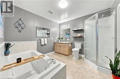Walk-in shower with frosted glass enclosure, large jetted tub - 915 St George Street, Port Dover, ON 