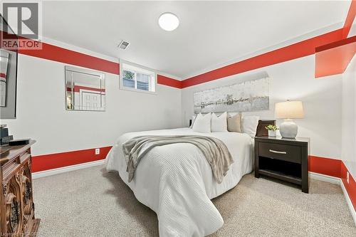 Carpeted flooring, recessed ceiling lighting, and a window with a white frame - 915 St George Street, Port Dover, ON 