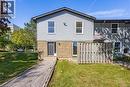 Two-story exterior featuring light-colored siding and brick accents - 70 Fiddlers Green Road Unit# 74, London, ON 