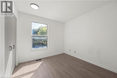 Recessed ceiling light fixture, wood-finish flooring, and single window with light-toned trim - 70 Fiddlers Green Road Unit# 74, London, ON 