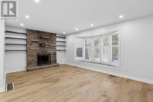 Living room with FP and bow window. - 211 Harcourt Avenue, Ottawa, ON 