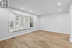 Huge bow window floods the space in light. - 