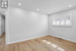Dining room offers hardwood floors and pot-lights - 
