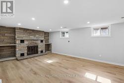 Floor to ceiling stone fireplace. - 
