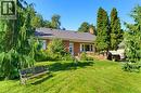 Brick exterior with white window shutters - 940 Harvey Place, Halton, ON 