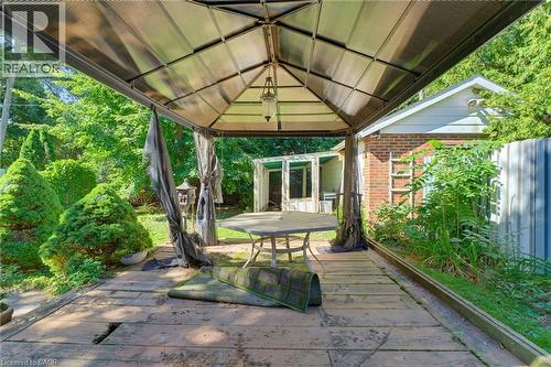 Covered outdoor patio with a translucent roof and wood-finish flooring - 940 Harvey Place, Halton, ON 