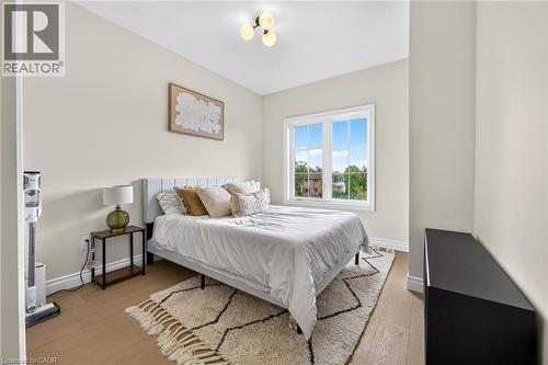 Recessed ceiling fixture, light wood-finish flooring, and white trim - 67 Cielo Court, Hamilton, ON 