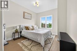Recessed ceiling fixture, light wood-finish flooring, and white trim - 