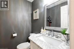White vanity with a marble countertop, undermount sink, and chrome faucet - 