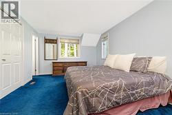 Recessed lighting, blue carpeting, and dual pane windows - 