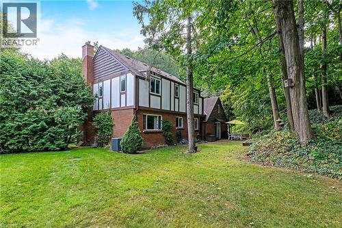 Brick and timber-frame exterior with multiple windows - 12 Mullen Place, Glen Williams, ON 