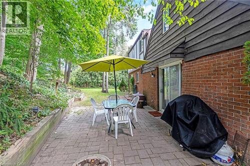 Brick exterior with horizontal wood siding - 12 Mullen Place, Glen Williams, ON 