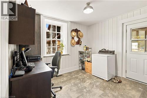 Hard-surface flooring, paneled walls, multi-pane window, flush-mounted lighting, and a solid exterior door with a window insert - 2744 Bleams Road, New Hamburg, ON 