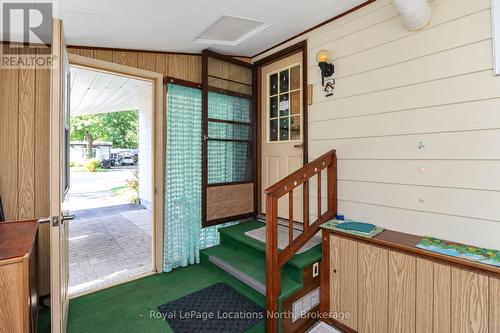 Door from carport to 3-season sunroom & side entry - 16 Sinclair Avenue S, Wasaga Beach, ON 