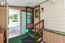 Door from carport to 3-season sunroom & side entry - 