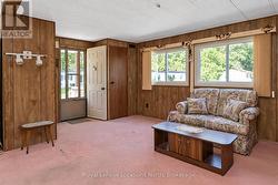 Front door entrance to large, bright living room - 