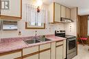 Galley-style kitchen (stainless-steel appliances) - 16 Sinclair Avenue S, Wasaga Beach, ON 