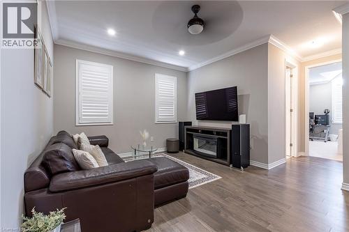Recessed lighting, crown molding, wood-finish flooring, and white window shutters - 455 Equestrian Way, Cambridge, ON 