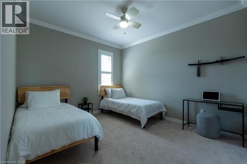 Recessed lighting, crown molding, ceiling fan, carpeted flooring, and a window with plantation shutters - 455 Equestrian Way, Cambridge, ON 