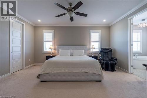 Recessed lighting, ceiling fan, white paneled door, shuttered windows, and crown molding - 455 Equestrian Way, Cambridge, ON 