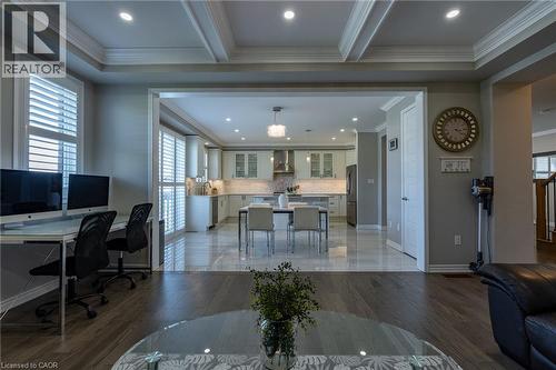 Wood-finish flooring with a coffered ceiling and recessed lighting - 455 Equestrian Way, Cambridge, ON 
