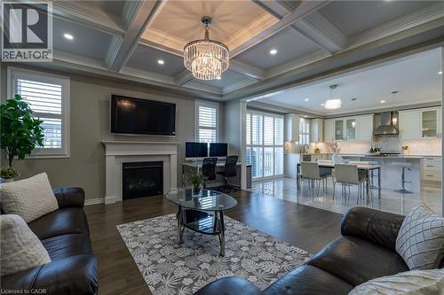 Coffered ceiling with recessed lighting and a crystal chandelier - 455 Equestrian Way, Cambridge, ON 