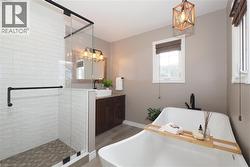 Updated ensuite bathroom with huge soaker tub, two person shower and heated flooring. - 