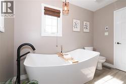 Updated ensuite bathroom with huge soaker tub, two person shower and heated flooring. - 