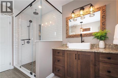 Updated ensuite bathroom with huge soaker tub, two person shower and heated flooring. - 76 Nith River Way, Ayr, ON 