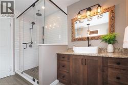 Updated ensuite bathroom with huge soaker tub, two person shower and heated flooring. - 