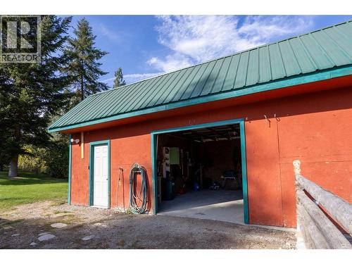 Meat chiller behind white door - 50 Taylor Way, Beaverdell, BC 