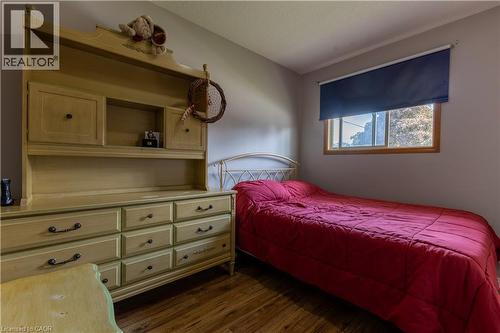 Wood-finish flooring with a single window featuring a roller shade - 120 Union Street S, Cambridge, ON 