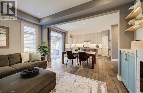 Recessed lighting and wood-finish flooring throughout - 35 Greyhawk Street, Kitchener, ON 