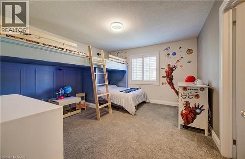 Integrated bunk beds with a natural wood ladder, wall paneling, carpeting, and plantation shutters - 35 Greyhawk Street, Kitchener, ON 