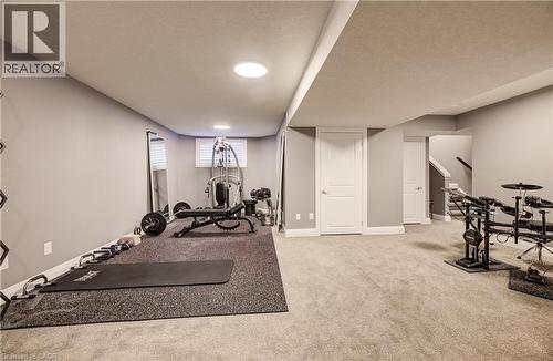 Recessed lighting, painted walls, carpeted flooring, finished ceiling, built-in staircase - 35 Greyhawk Street, Kitchener, ON 