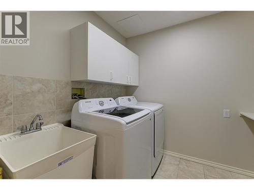Laundry on the lower level - sink and cabinets - 4632 / 4624 Minto Street, Peachland, BC 