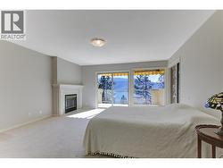 Primary bedroom with access to deck PLUS lake and mountain views! - 
