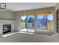 Primary bedroom with access to deck PLUS lake and mountain views! - 