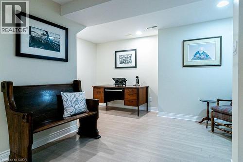 Recessed lighting illuminates the light wood-finish flooring and neutral wall tones - 89 Little John Road, Dundas, ON 