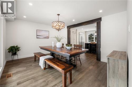The dining area, highlighted by a large bay window overlooking the streetscape, flows from the kitchen and can also serve as a formal living space. - 75 Lyon Avenue, Guelph, ON 