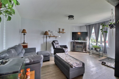 Salon - 641 2E Rue O., Barraute, QC - Indoor Photo Showing Living Room With Fireplace