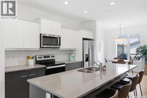 171 Taube Avenue, Saskatoon, SK - Indoor Photo Showing Kitchen With Double Sink With Upgraded Kitchen