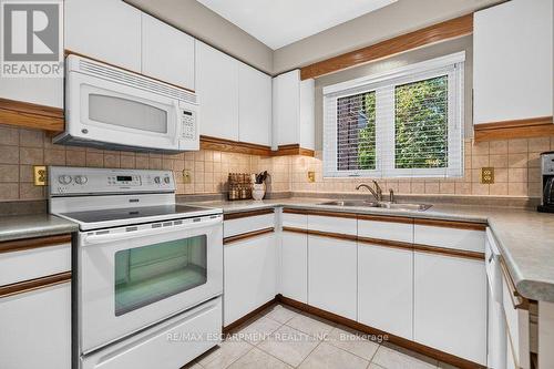 8 - 2136 Old Lakeshore Road, Burlington, ON - Indoor Photo Showing Kitchen With Double Sink