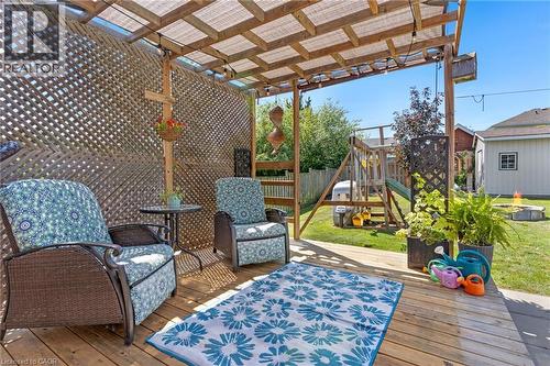 Decked patio area with a wooden lattice privacy screen and a pergola-style cover - 311 Misty Crescent, Kitchener, ON - Outdoor With Deck Patio Veranda